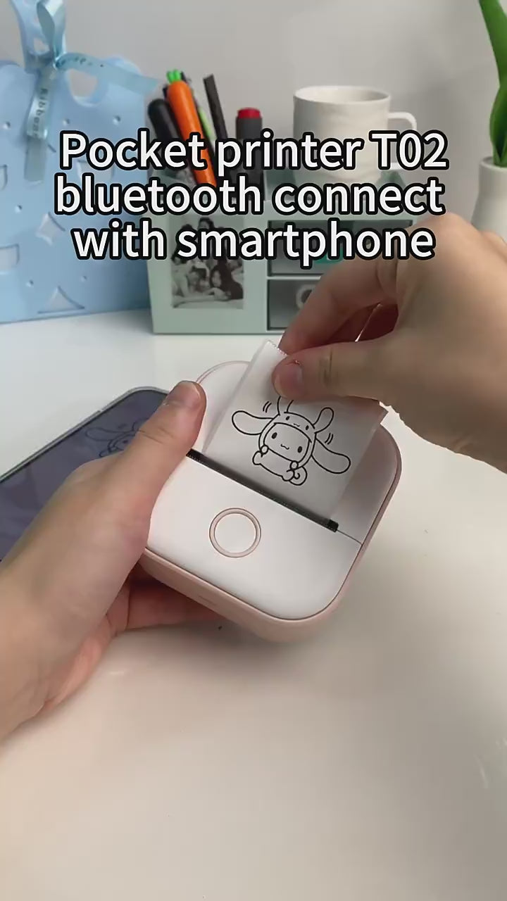 Thermal sticker printer printing photo stickers via smartphone connection.