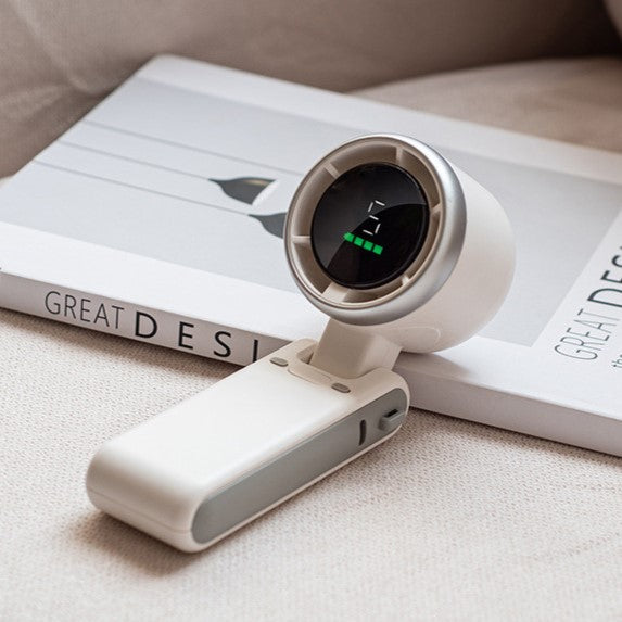 White tabletop fan folded at 90 degrees with USB charging port visible.