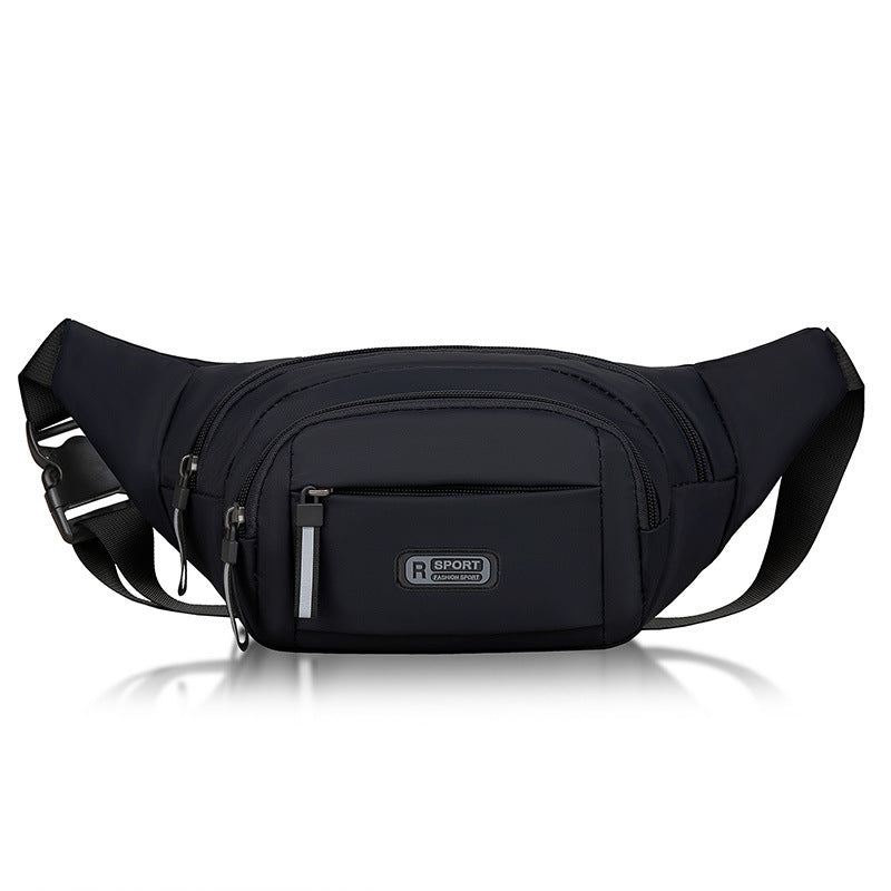 Compact sling pack in black with sleek water-resistant finish.