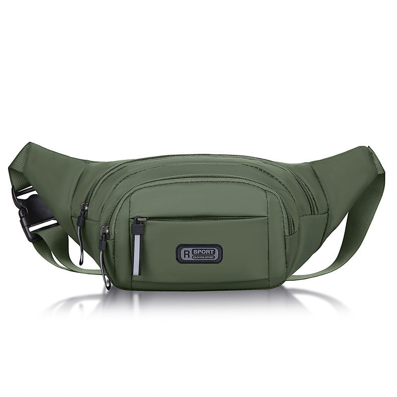 Compact sling pack in green with front zipper pocket and adjustable buckle strap.