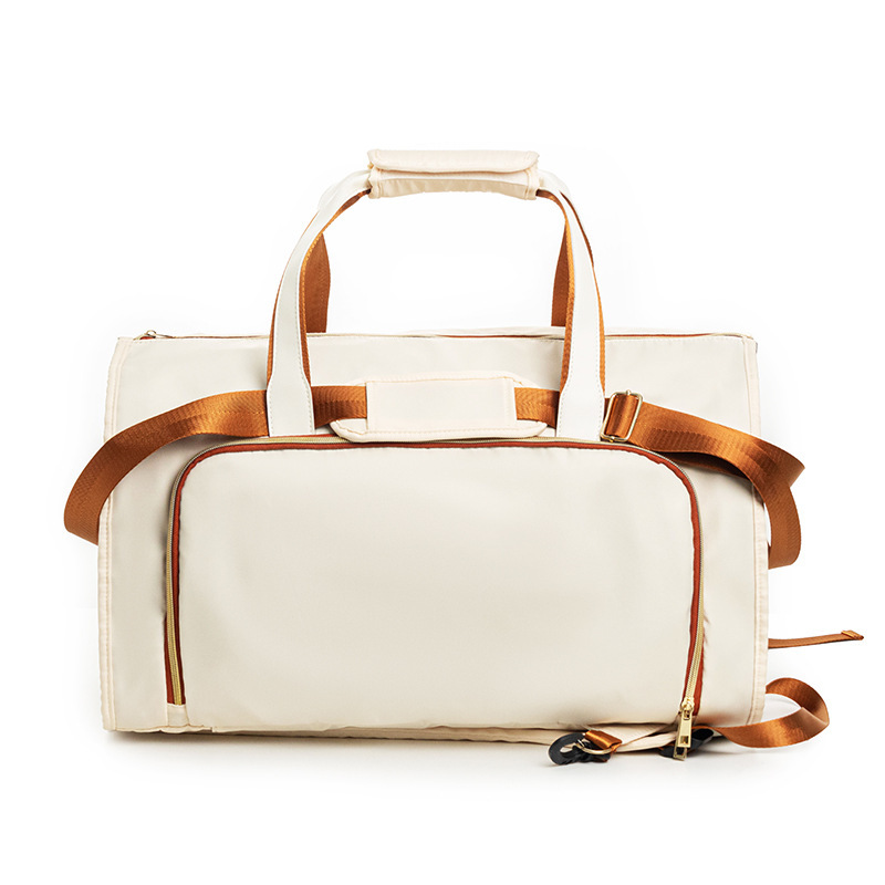 Beige travel suit duffel bag with leather-style straps and zip pocket.