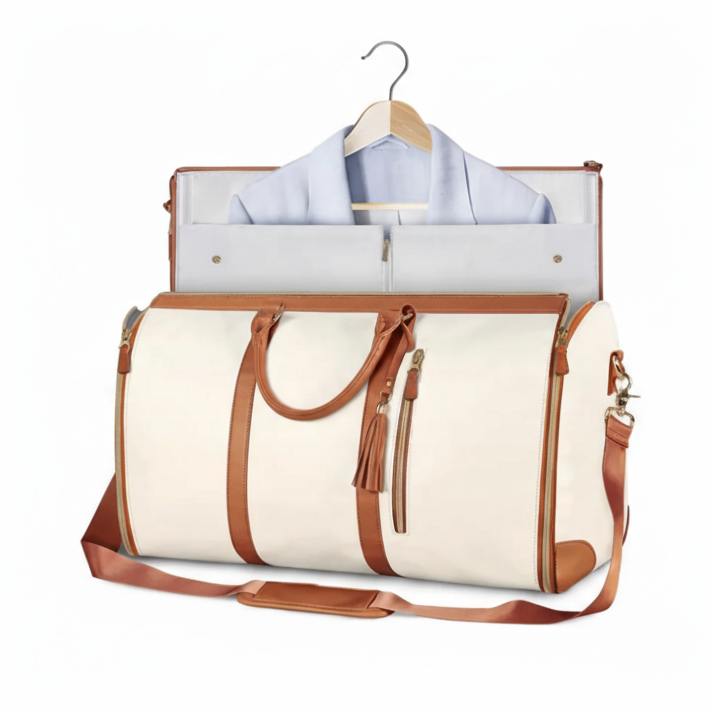 Weekender duffel in cream color displayed with garment setup and hanger.