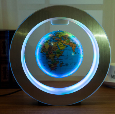 Floating globe with a blue world map design suspended in an LED-lit circular base.