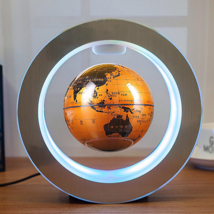 Floating globe with a warm yellow world map design illuminated inside a circular frame.