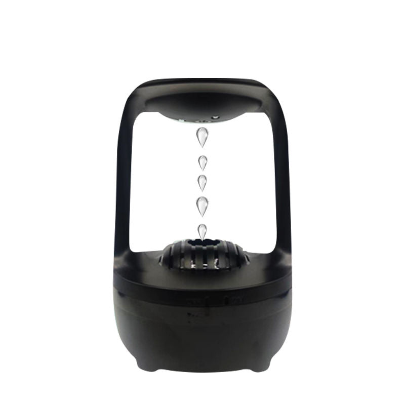 Black anti-gravity humidifier with floating water droplets inside a modern ABS frame.