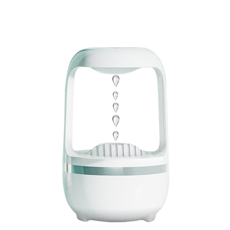 White anti-gravity humidifier showing upward-floating water droplets in clear view.