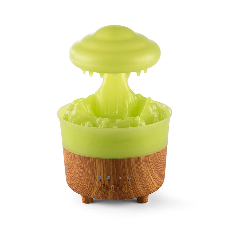 Green raincloud humidifier with cascading raindrop effect and wood-style base.