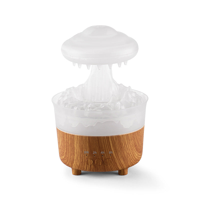White raincloud humidifier with flowing water droplets and soft mist output.
