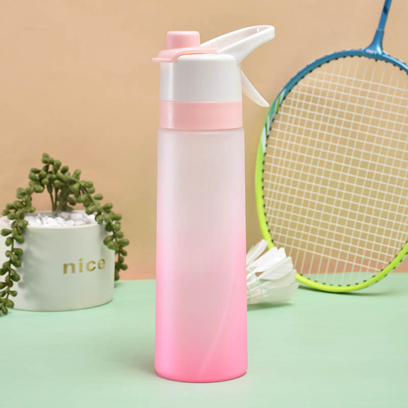 Gradient pink spray water bottle shown near a tennis racket.