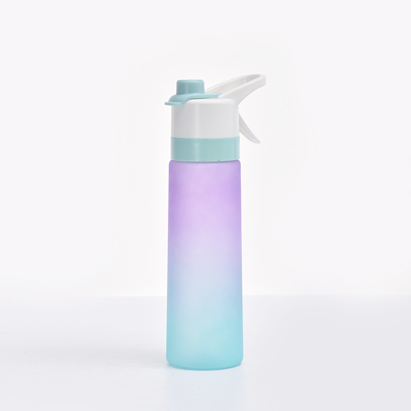 Gradient purple spray water bottle displayed on a neutral background.