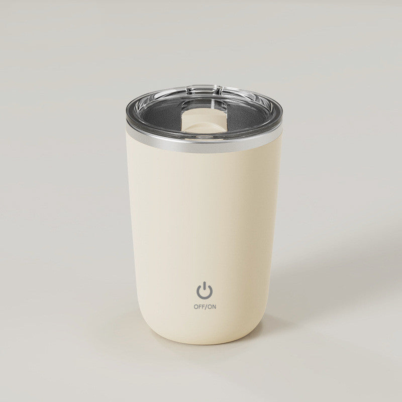 Beige automatic stirring cup with stainless-steel interior and clear lid.