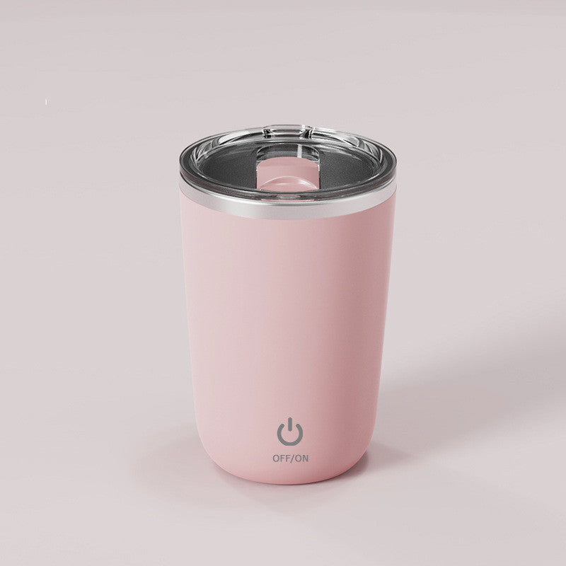 Pink self-stirring cup with stainless steel liner and modern design.