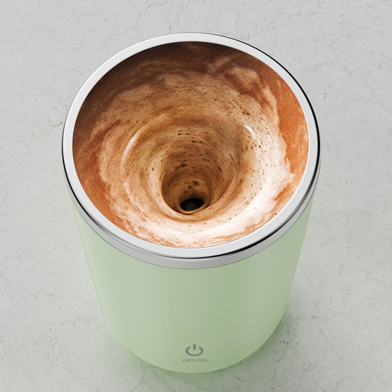 Close-up top view of beverage spinning rapidly inside cup.