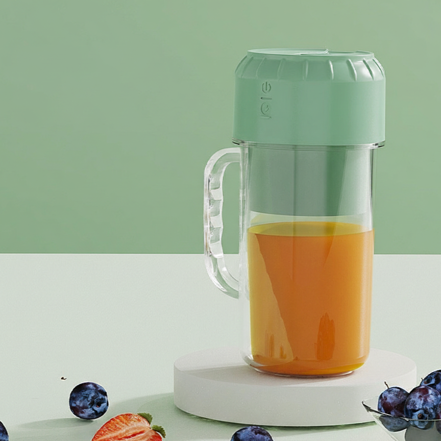 Green portable blender with handle and direct-drink lid.