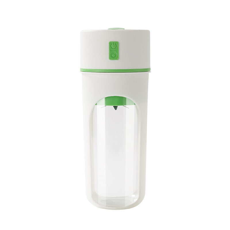Compact portable juice blender cup in green color.