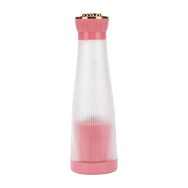Slim pink portable blender designed for travel smoothies.