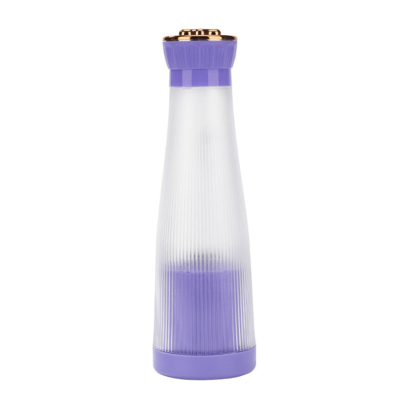 Compact purple USB rechargeable blender for fruit drinks.
