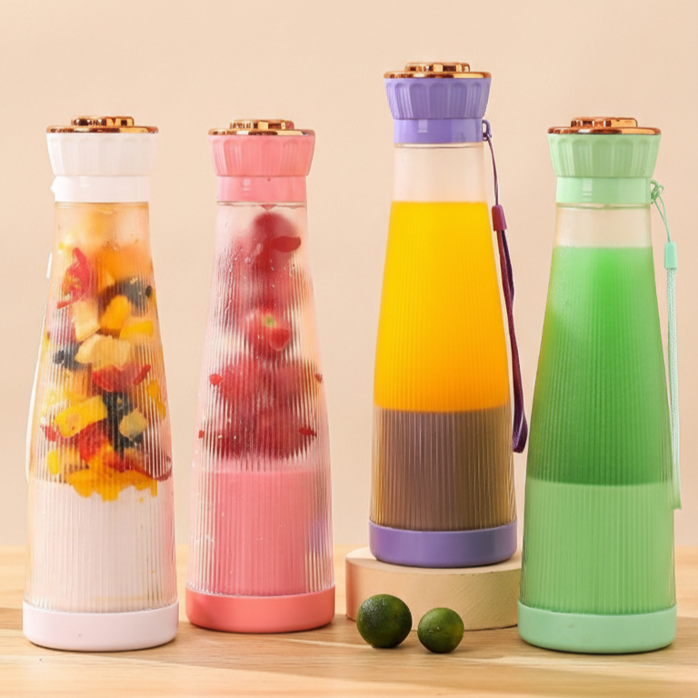 Slim portable blenders in multiple colors on a kitchen table.