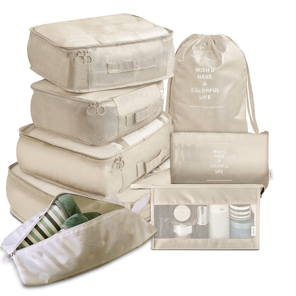 Travel organizer set in beige showing complete packing cube collection.