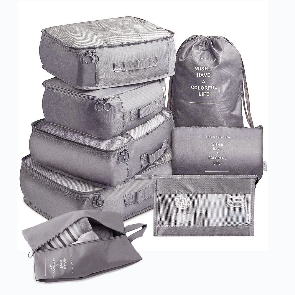 Travel organizer set in grey with waterproof toiletry pouch and drawstring bag.