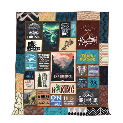 Camping blanket with hiking and mountain graphics in mixed earth tones.