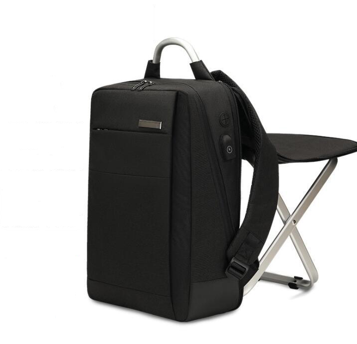 Black variant of multifunction travel backpack with integrated seat folded against back panel.