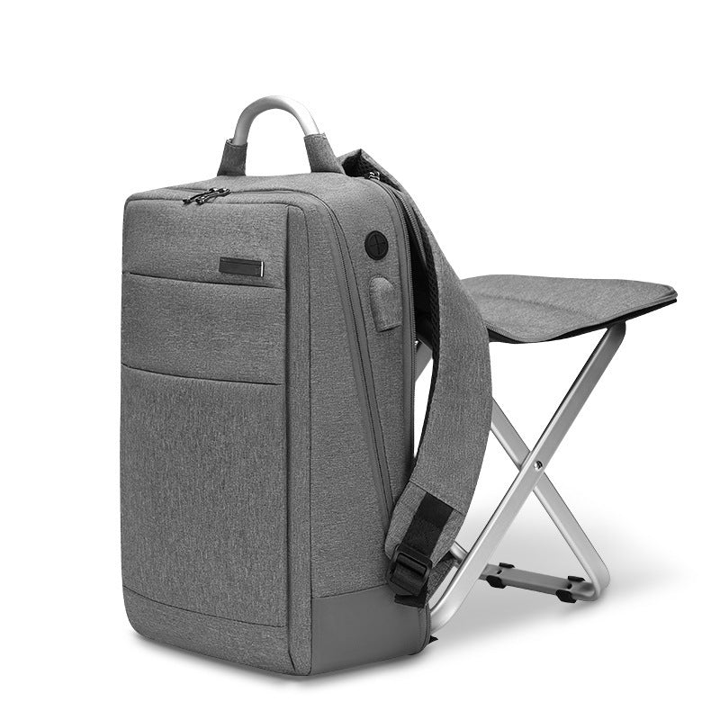 Grey travel backpack shown standing upright with built-in folding aluminum chair attached.